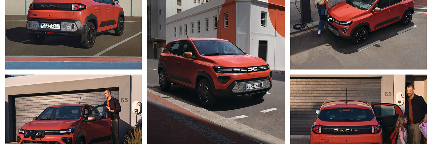 Profitieren Sie vom Investionsbooster - Mehr Auto. Weniger Steuern Ein orange-roter Dacia der auf einem Parkhausdach in einer Metropole parkt neben einer E-Ladesäule.